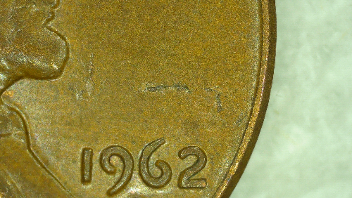 1962-D-Lamination-On-Obverse-Through-Liberty