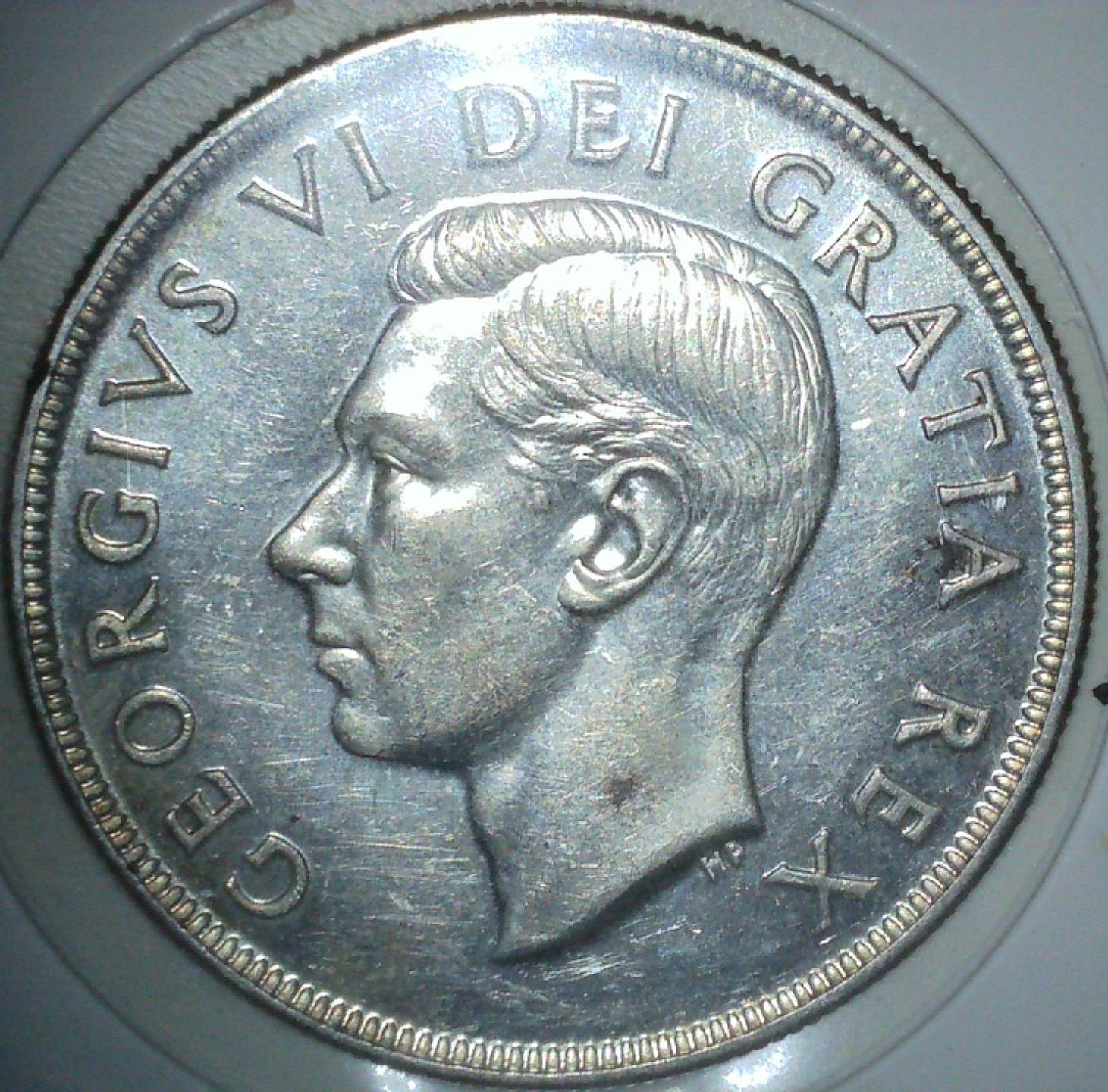 1951-Canadian-Dollar---Triple-Or-Quadruple-Hp?