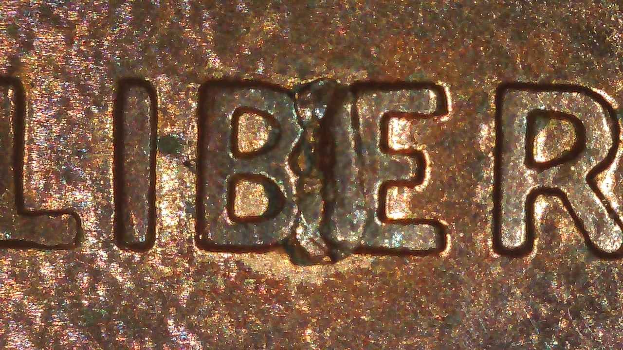 1995-Penny-With-Trifecta-Bie,-Spike-Head-&-Nice-Die-Crack