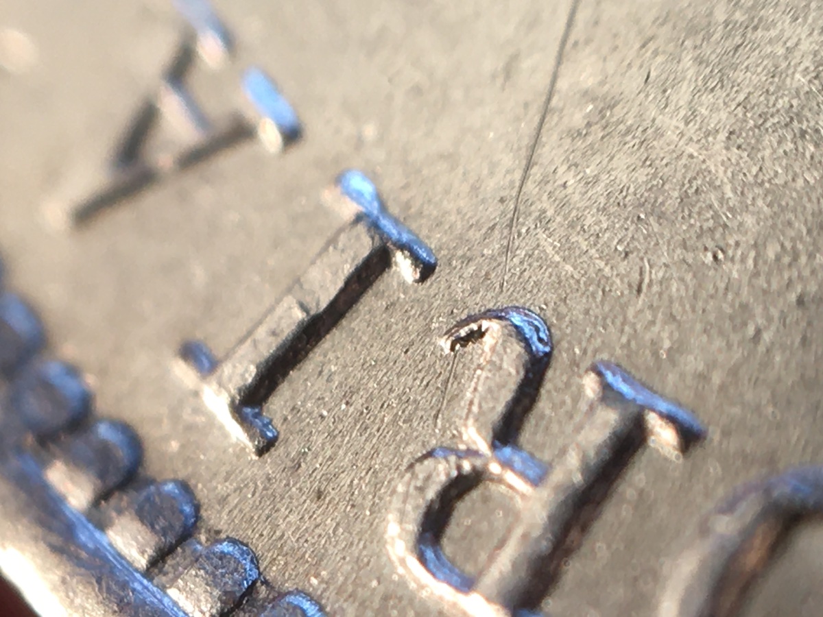 Scratch-On-An-MS-Coin