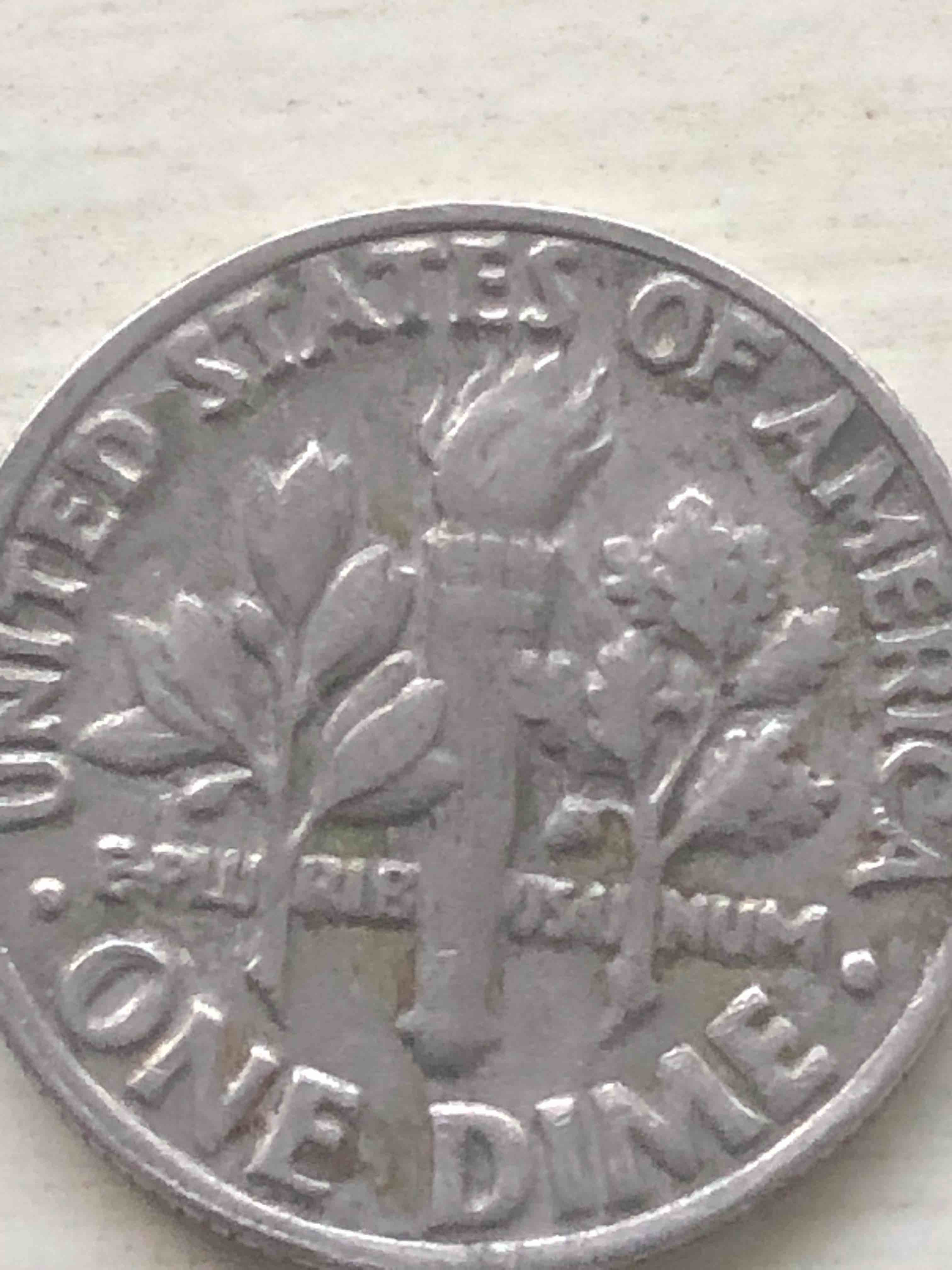 1985-Dime-Torch-Touching-The-Letter-?