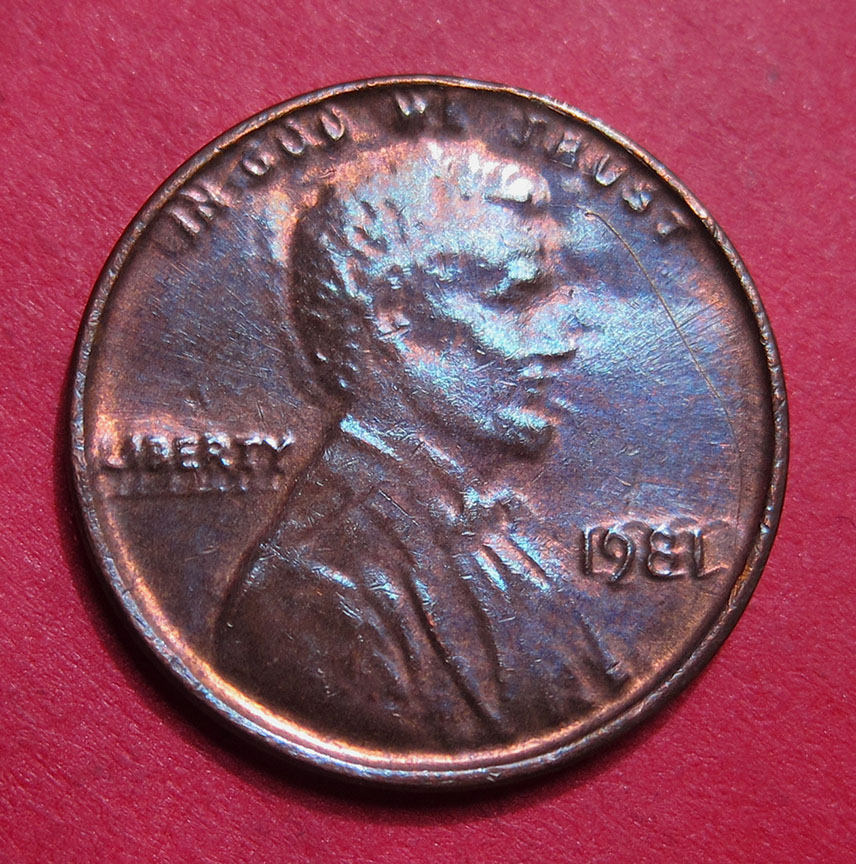 1981-Lincoln-Memorial-Cent-Mint-Error---Struck-Through-Late-Stage-Die-Cap