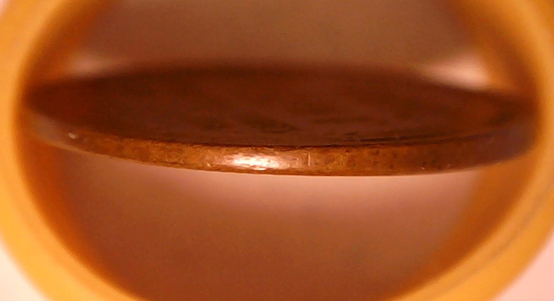 1955-Lincoln-Cent-Struck-On-A-Thinner--Planchet-/-Tapered-Planchet-?