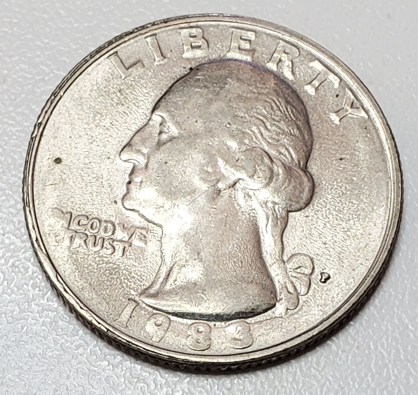 1983-P-Quarter-Strike-Through-Or-Dryer-Coin-Or-Worn-Die?