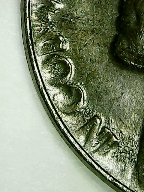 1955-P-Jefferson-Nickel-With-Odd-Flow-Marks-In-Design.