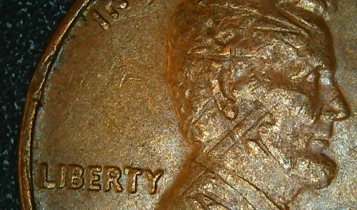 1976-P-LMC-Indent-Obverse-Error-Lincoln's-Face-Has-Part-Of-The-Memorial-From-The-Reverse.