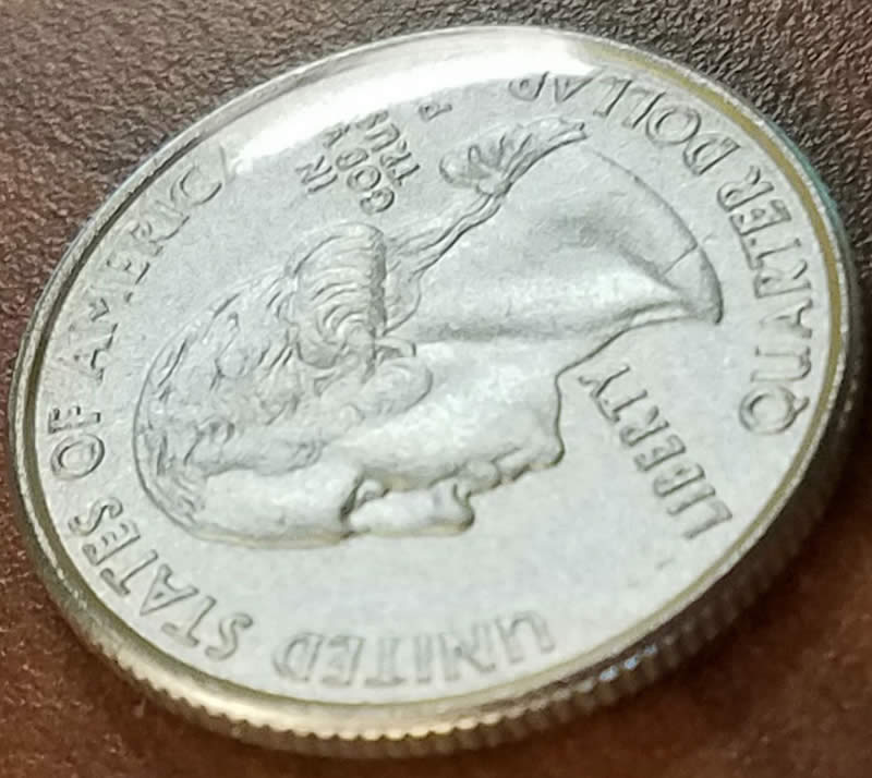 2000-Maryland-State-Quarter-With-Odd-Yellow-Tint-And-Plastic-Coating