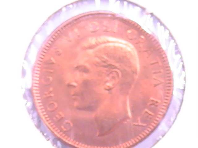 1949-Canada-Cent-Punched-On-Foreign-Planchet