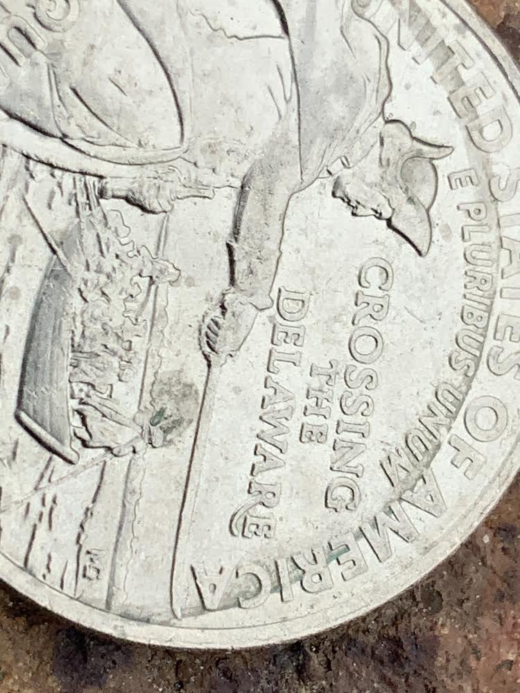 Potential-Mint-Error-Lamination-Or-Punching-On-2021-D-Crossing-The-Delaware-Quarter