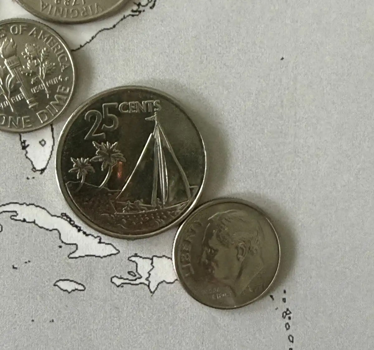 Working-On-A-World-Map-Made-Of-Coins.