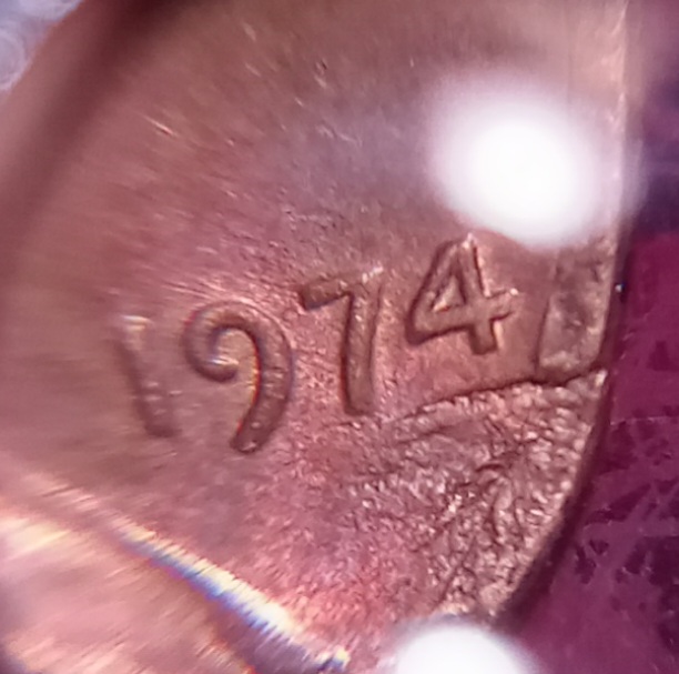 1974-P-1-Cent.-Is-This-Coin-Damaged-By-A-Feeder-Finger,-Or-Post-Mint?-Is-It-A-Denver-Minted-Coin?