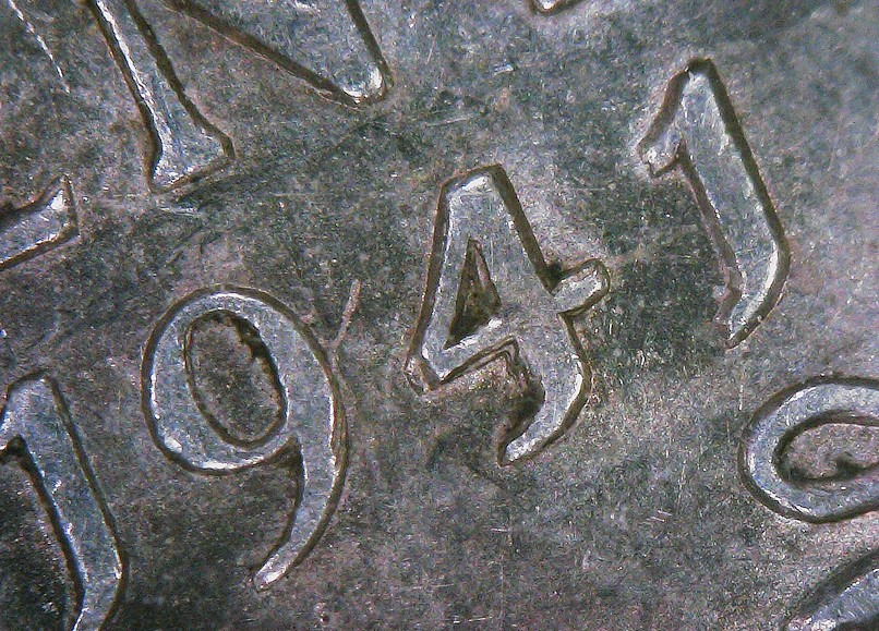 Is-This-1941-Newfi-5-Cent-Have-A-Repunched-4?