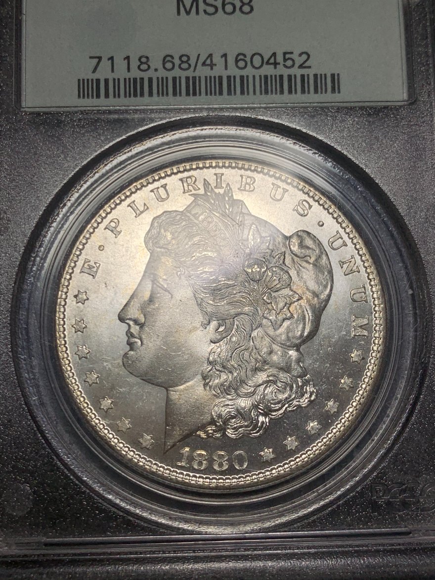 Showing-Off-A-New-Pickup.1880-S-Morgan-PCGS-MS-68-OGH