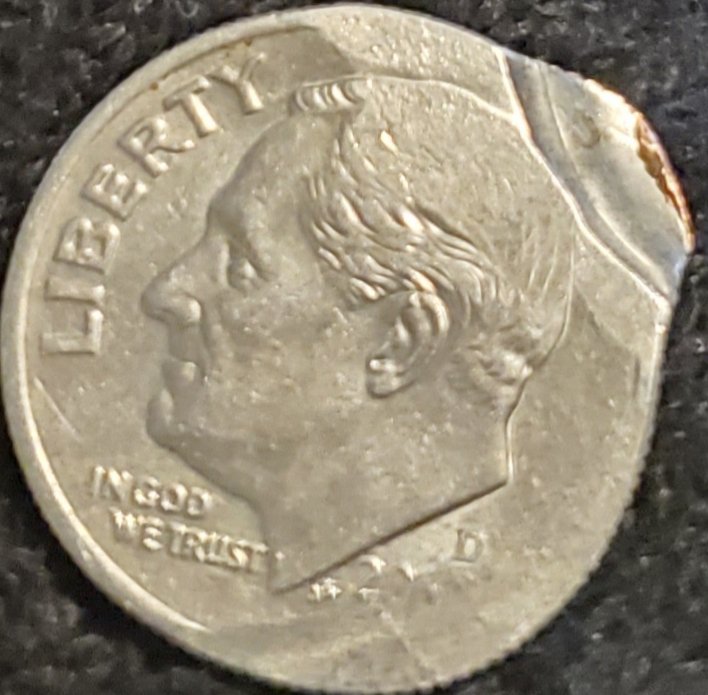 Can-Anyone-Tell-Me-About-This-Strange-Messed-Up-Dime?