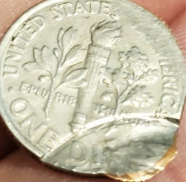 Can-Anyone-Tell-Me-About-This-Strange-Messed-Up-Dime?