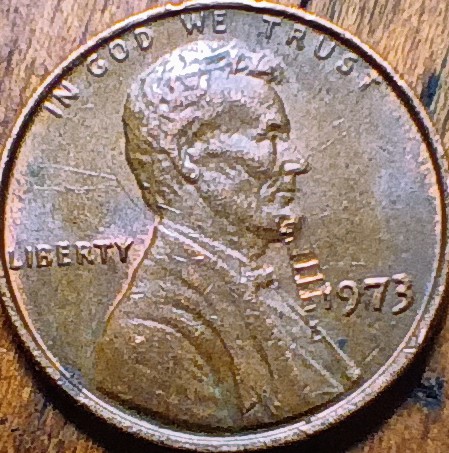 1973-Penny-Obverse-Has-Track-Marks-Across.-The-Surface