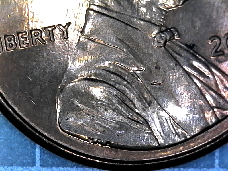 2000-D-Cent-With-Two-Horizontal-Indentations-On-Jacket
