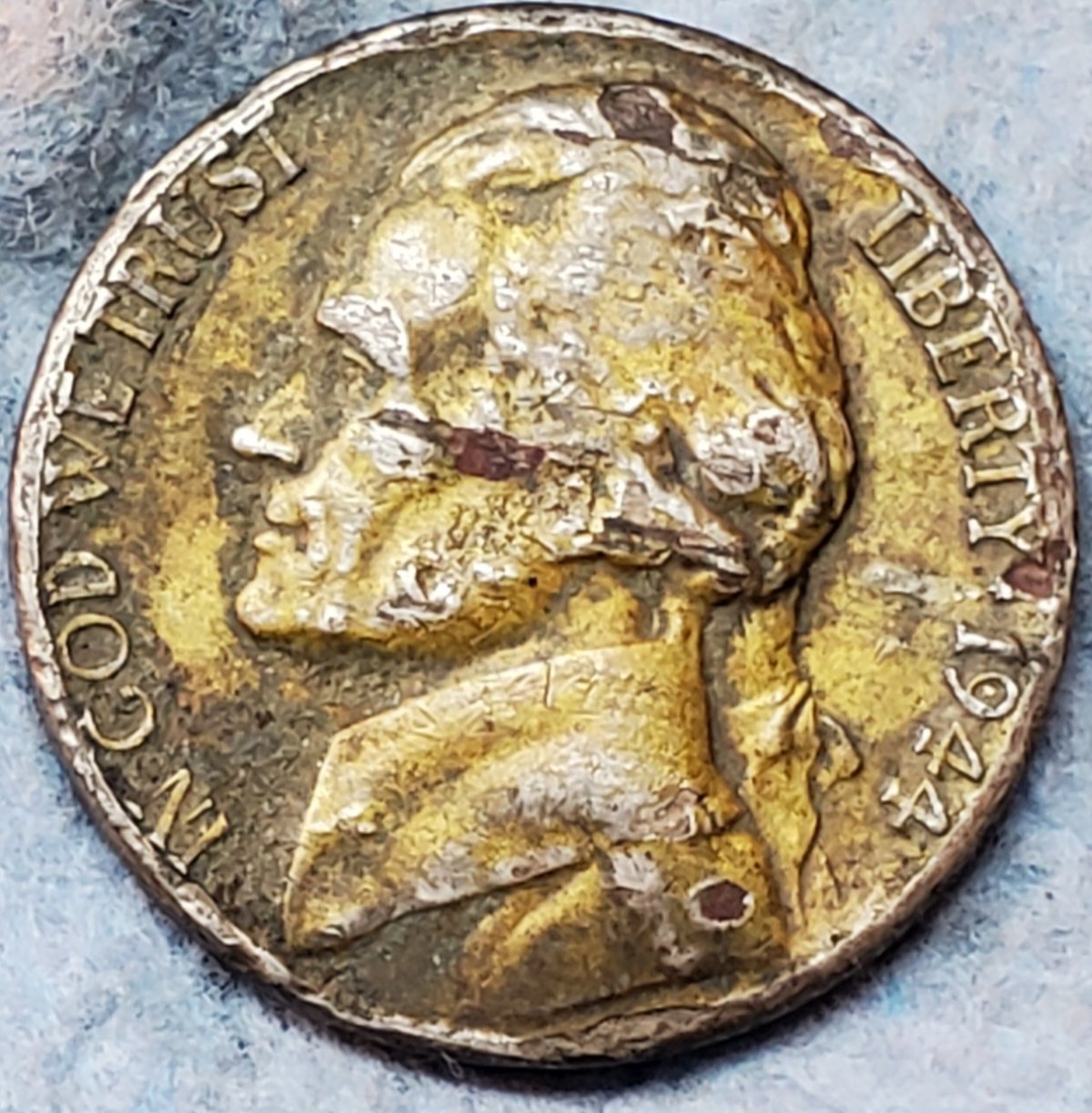 What-Is-This-Yellow-Tint-On-This-1944-P-War-Nickel?