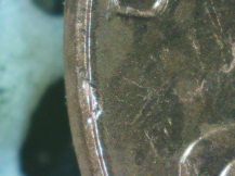 2015-P-Lincoln-Cent-Struck-Through-Wire-Or-Metal-Scraps?--X's-3-Or-4