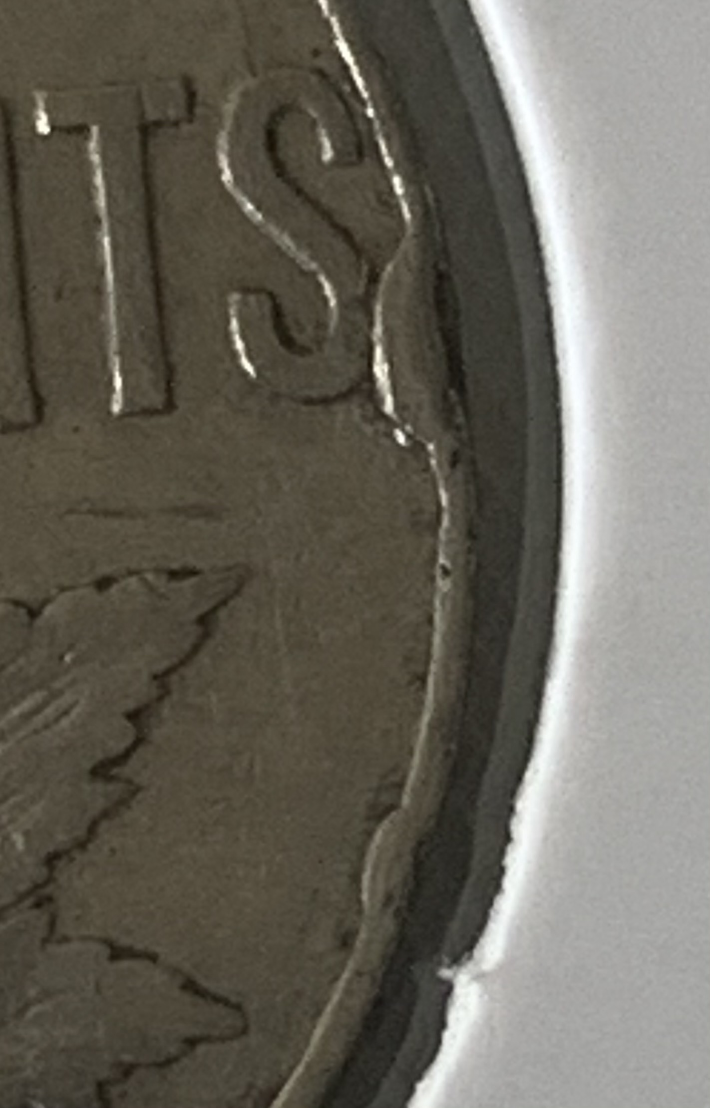 1934-Canadian-5-Cent-Error-On-Rim?