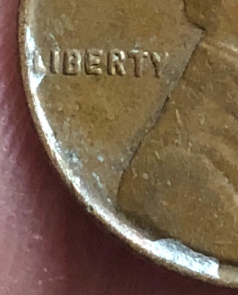1955-D-Wheat-Penny.-Silver-On-Obverse-Along-The-Rim.