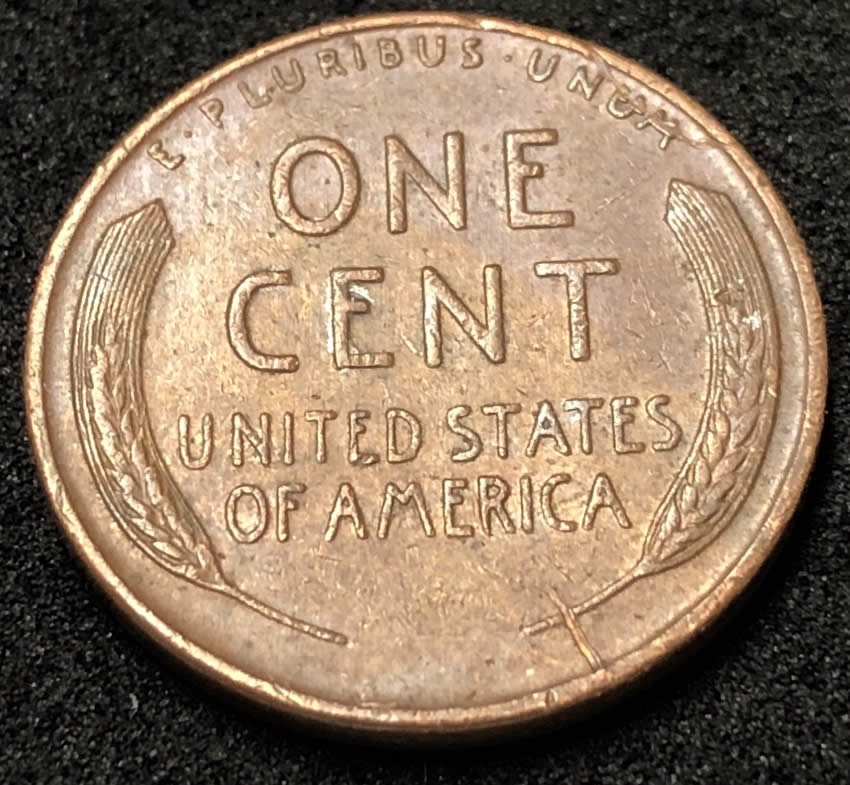 1955-D-Wheat-Penny.-Silver-On-Obverse-Along-The-Rim.