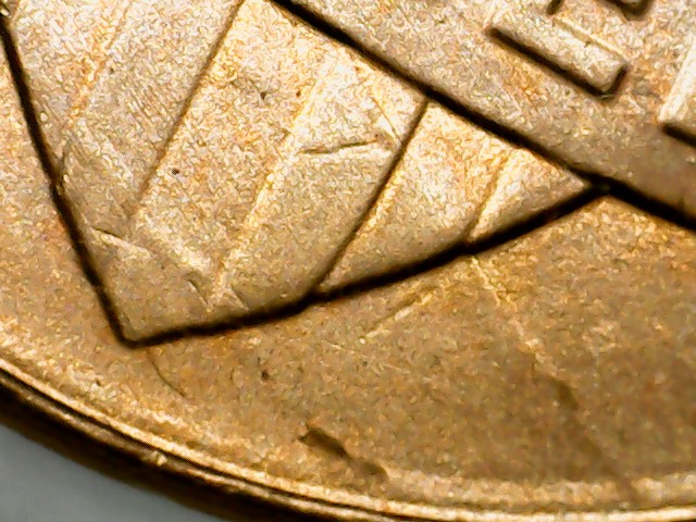 2013-Lincoln-D-Shield-Die-Cracks-Reverse