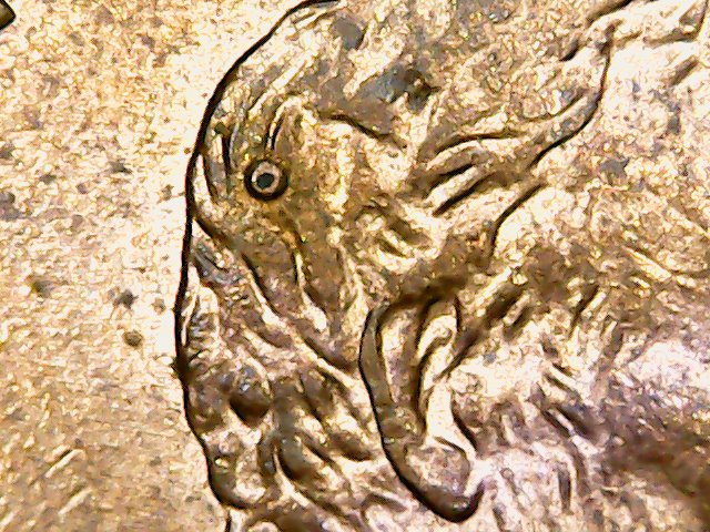 1995-Penny-Weird-Circle-Above-Ear.-Just-Damage?