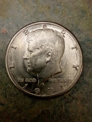 Found-A-1971-D-Half-Dollar-With-Marks-In-Between-Lettering-And-The-Date?