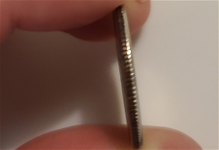 What-Causes-The-Copper-Color-On-The-Rim-Of-Quarter-To-Turn-Black?