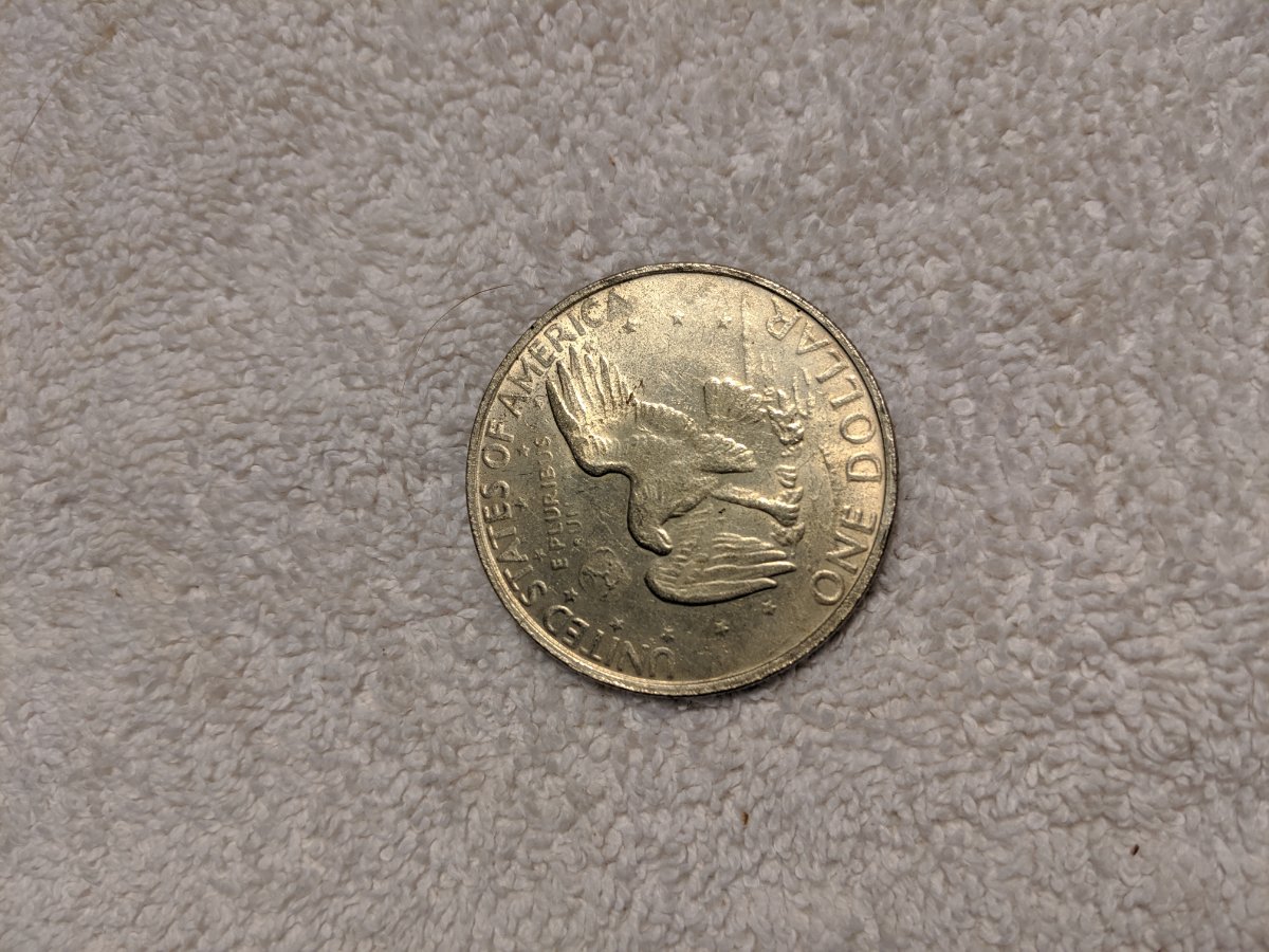 1977-S-Dollar-Silver-One-Legged-Eagle,-Struck-Through-Grease?