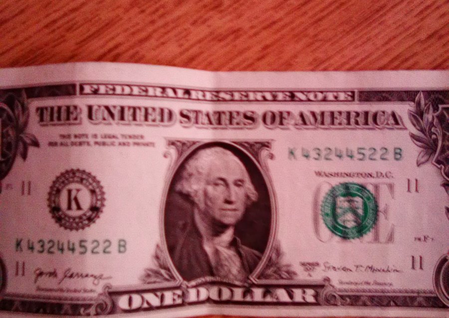 Is-A-$1-Note-That's-Cut-With-More-Space-Along-Top-Worth-More-Than-$1?