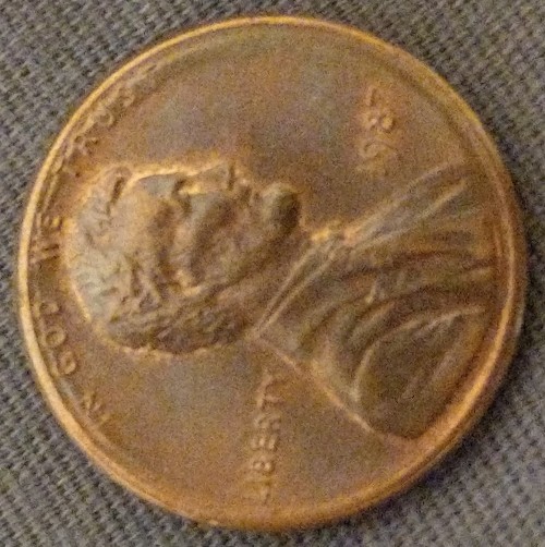 1987-Penny-W/-Strange-Rim-Through-