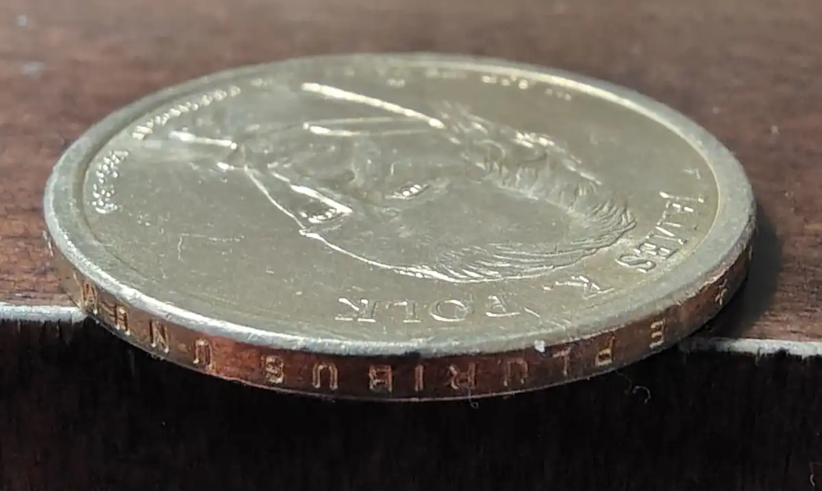 Inscription-On-Edge-Of-Presidential-$1-Coin-Is-Upside-Down