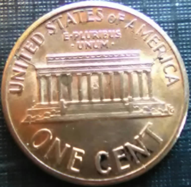 1990-Cent-With-Double-Die-Cracks-At-Top-Corners-Of-Memorial