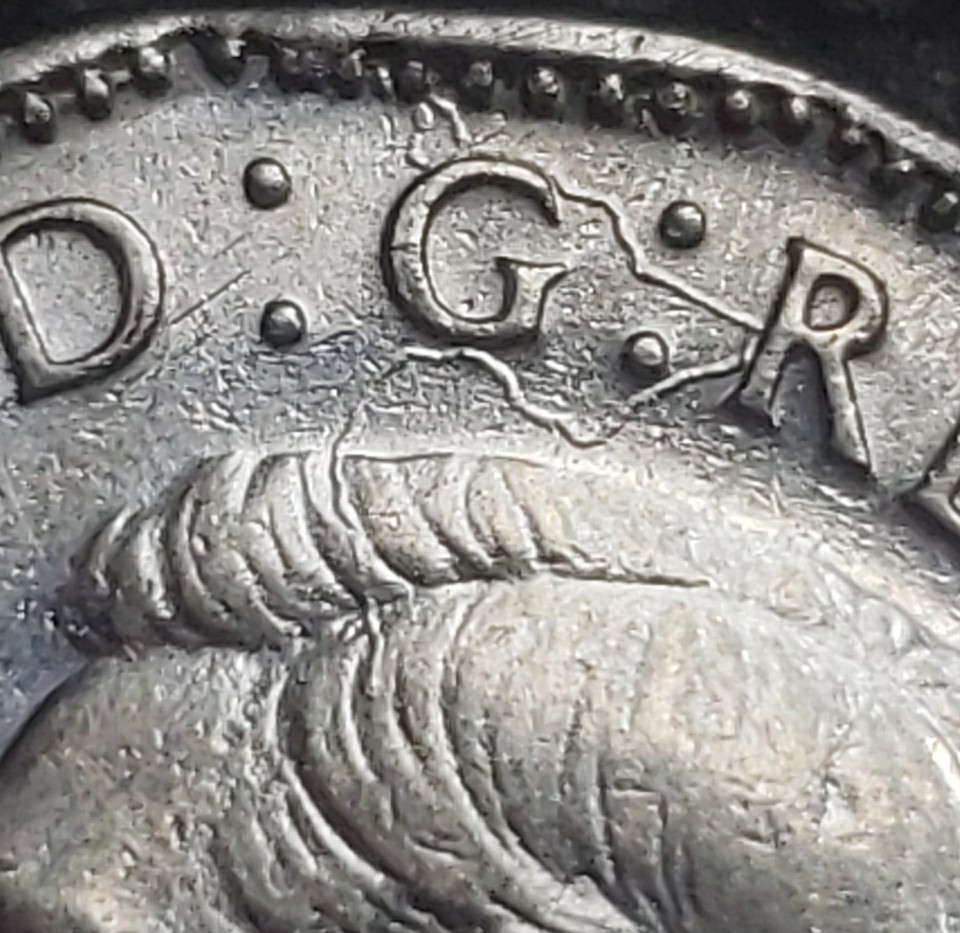 1945-Nickel-Struck-Through-String/Fabric?