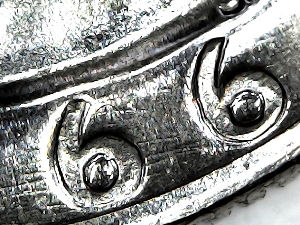 Raised-Lines-Connecting-The-Date-In-A-1966-Liberty-Quarter
