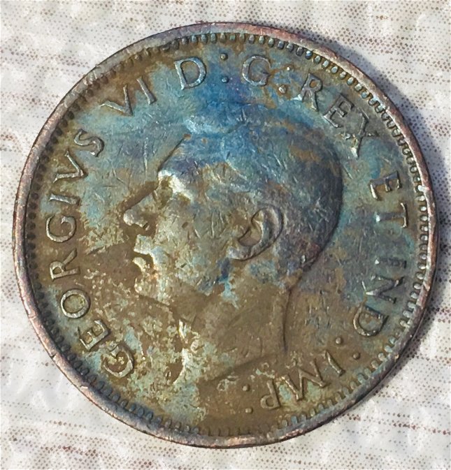 What-Could-Cause-Extreme-Shades-Of-Aqua-Blue-And-Violet-On-George-VI--Cent?