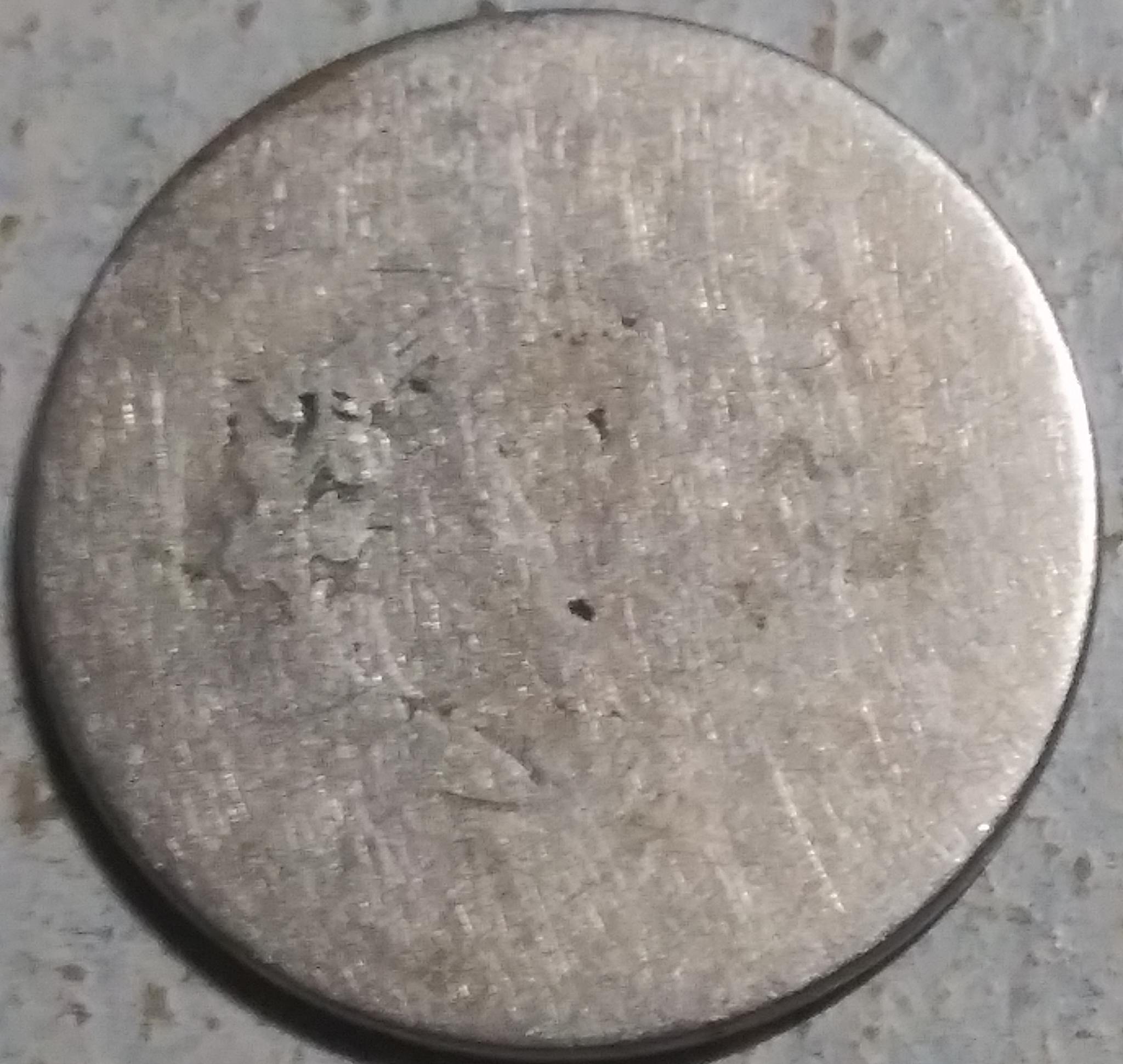 Beat-Up.-And-Battered-Barely-Recognizeable-Coin