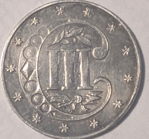 Help!-Very-Nice-Silver-Trime-With-What-Looks-Like-A-Strike-Through.