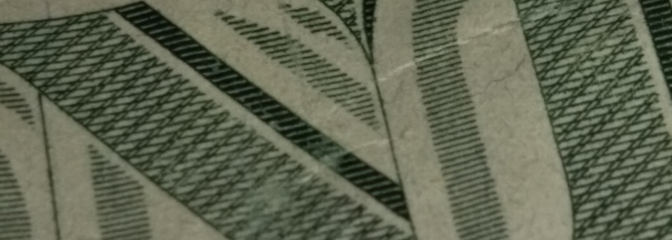 2013-Dollar-Bill-Looks-Like-Thread-Is-Through-Face