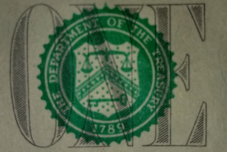 2013-Dollar-Bill-Looks-Like-Thread-Is-Through-Face