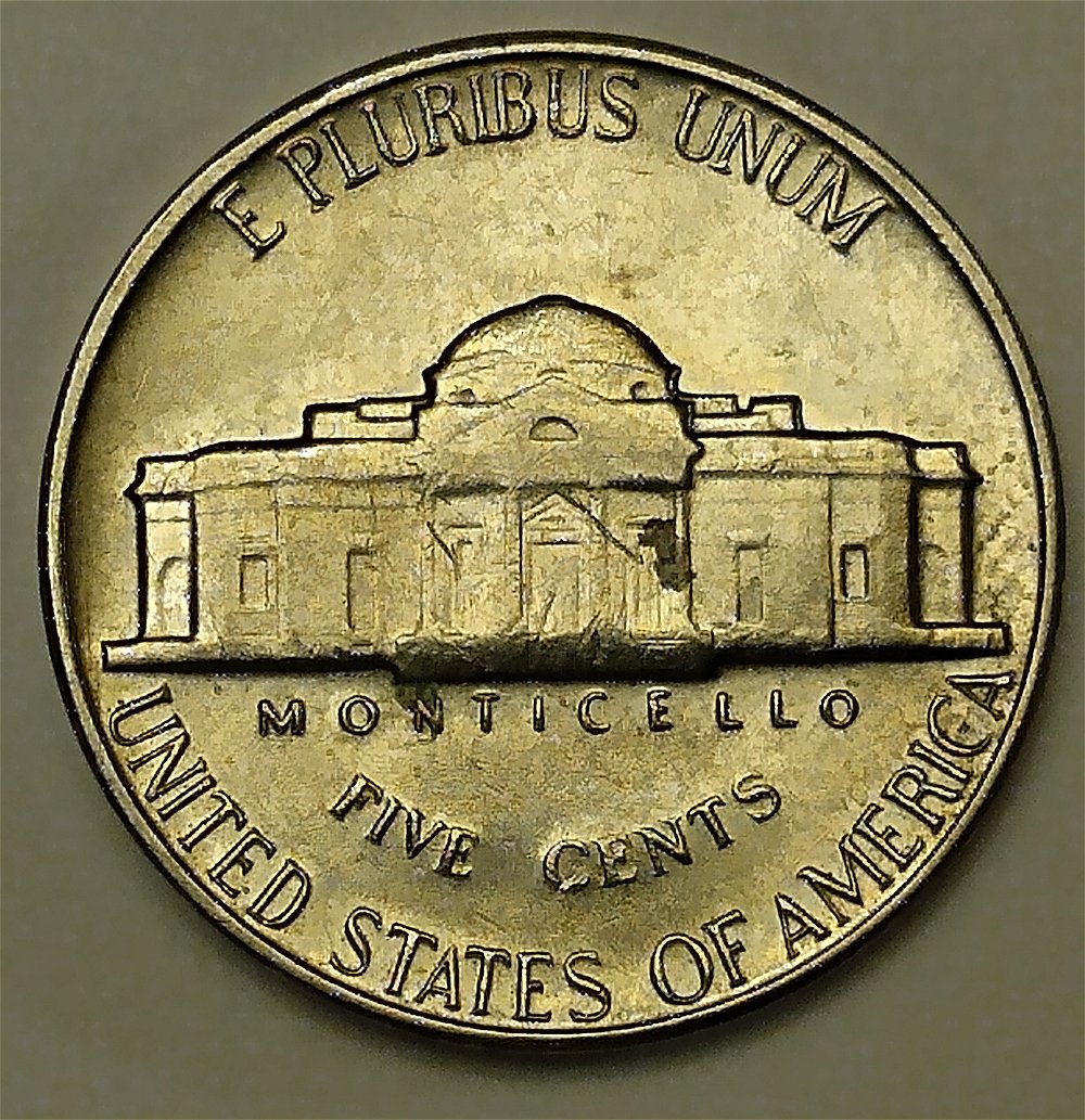 1969-D-Nickel.-It's-Swelled-On-Both-Sides-Missing-Stairs-And-Other-Things