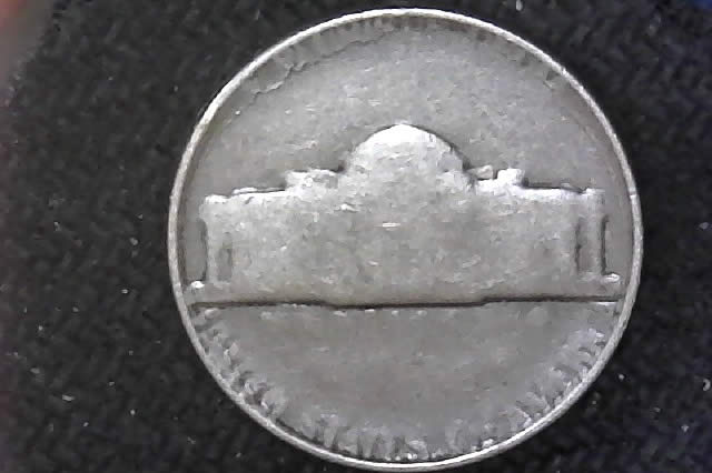 A-Mysterious,-Clad-Less,-Unidentifiable-Jefferson-Nickel