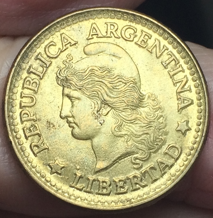 MD-In-Letters-And-Circular-Dots--Near-The-Edge-Of-This-Argentinian-Coin-?