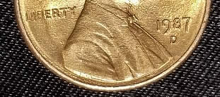 Strange--Fg-Stamp-Looks-Slanted-1987-D-Lincoln-Cent