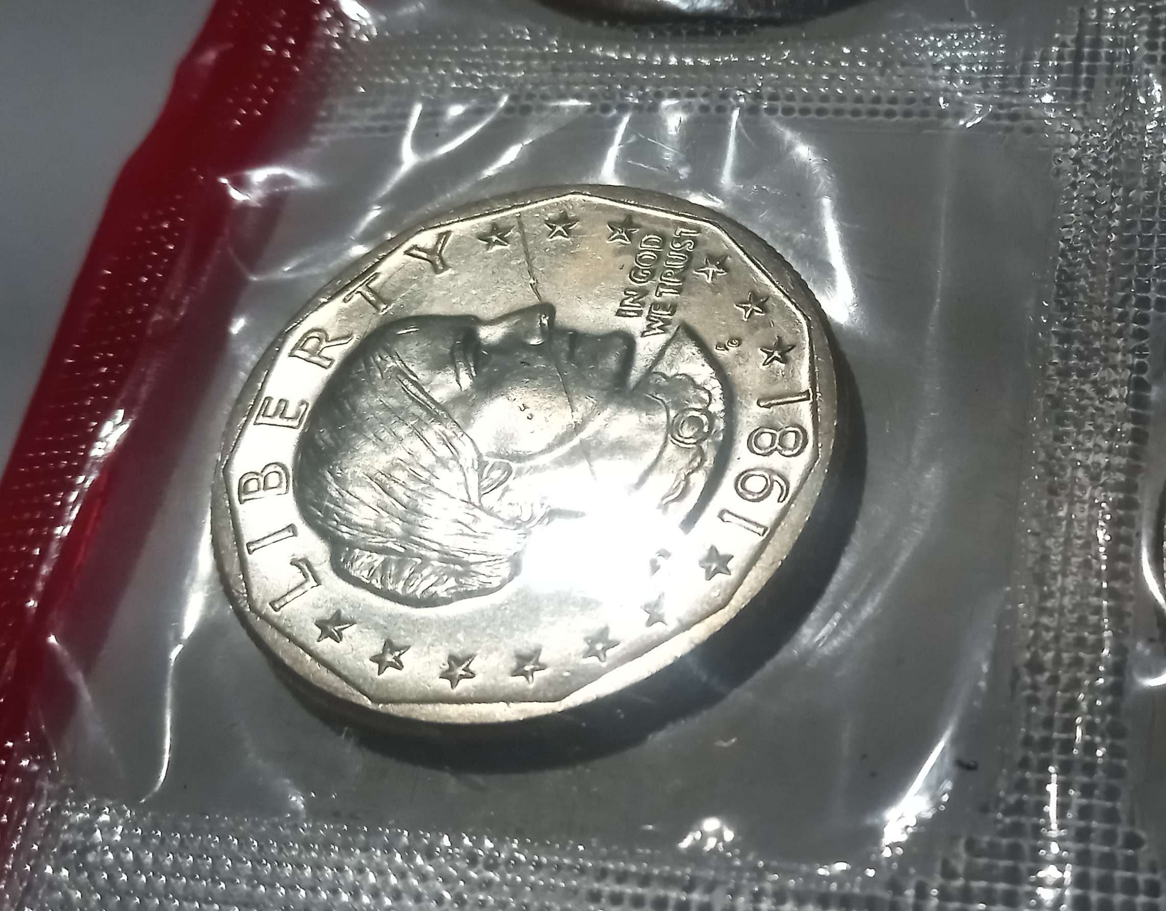 Uncirculated-SBA-Dollar-In-Intact-Mint-Cellophane-With-Mystery-Scratch