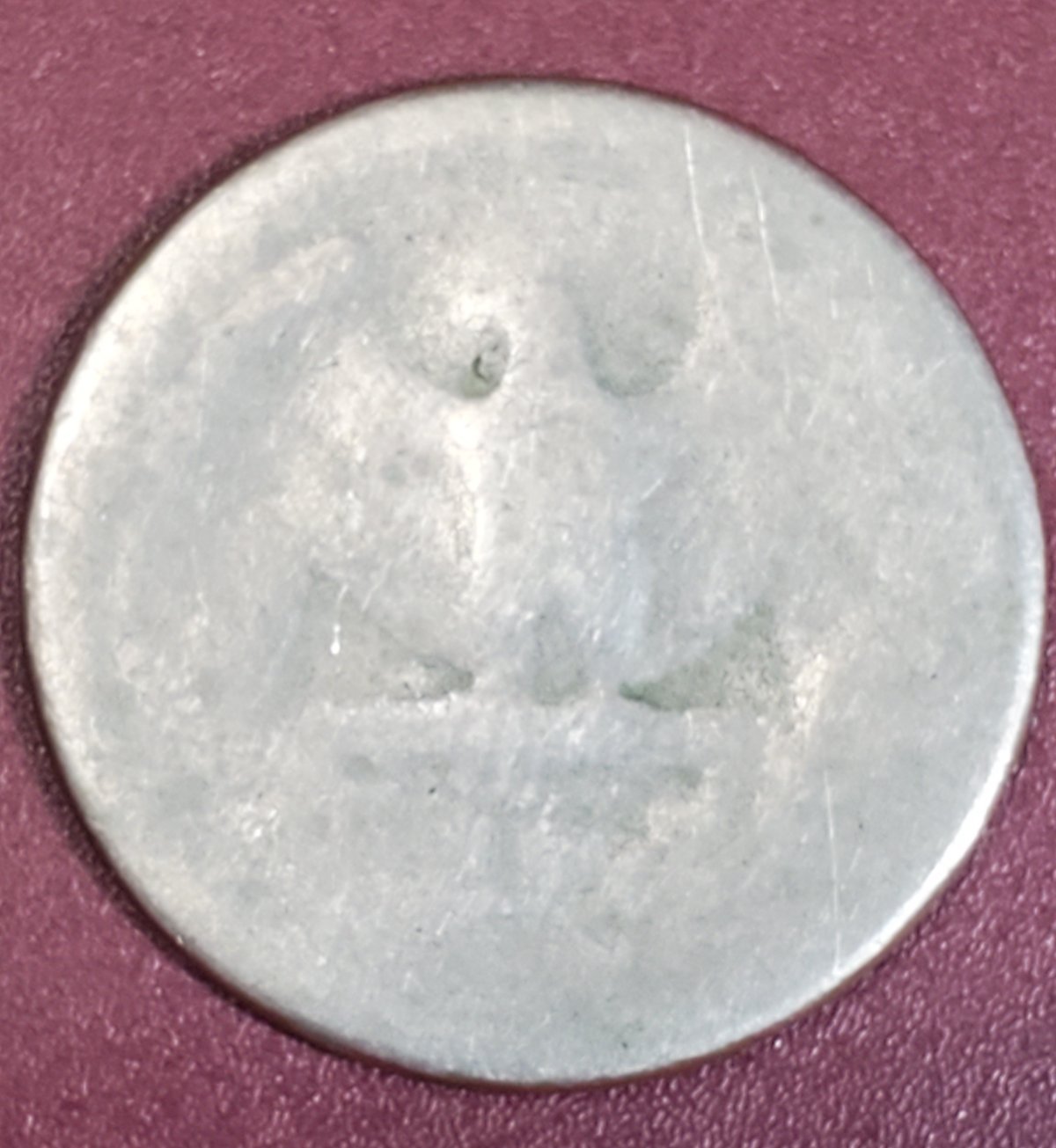 Not-Sure.-Quarter-Silouette-But-Very-Very-Thin,-Weight-4.04g