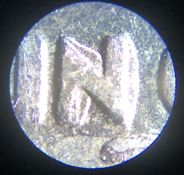 1995-Quarter-With-Something-Underneath-Letters