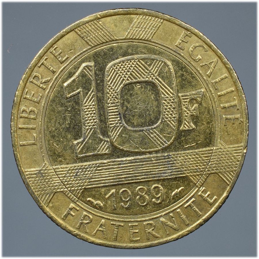Common-Twentieth-Century-Coins-Of-Gold-Color,-But-Not-Gold.